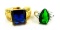 Two rings. Seller's description states 'green emerald ring, size 7; princess cut blue sapphire ring,