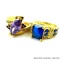 Two rings. Seller's description states 'marquise cut purple amethyst ring, size 9; blue sapphire