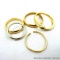 13.4 grams of 14K gold estate rings. Sizes 4-1/2, 7-1/2, 10-3/4, 11, and one cut/snipped. One is a