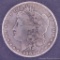 1883 Morgan silver dollar.