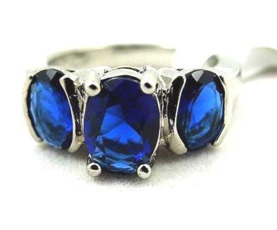 Seller's description states 'oval cut blue sapphire ring, size 7'.