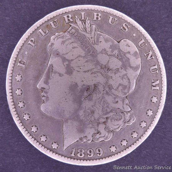 1899 O Morgan silver dollar.