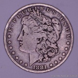 1881 O Morgan silver dollar.