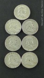 Seven Franklin silver half dollars, 1949-1961. No mint marks. Some gaps in dates.
