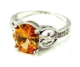 Seller's description states 'champagne topaz ring, size 9'.