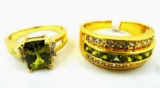 Two rings. Seller's description states 'olive green peridot ring, size 9; olive green peridot band,