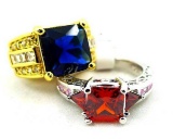 Two rings. Seller's description states 'princess cut blue sapphire ring, size 8; princess cut red