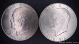 1976 D Eisenhower copper clad dollar; 1976 S Eisenhower silver clad dollar. Both uncirculated.