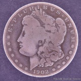 1902 O Morgan silver dollar.