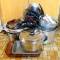Large aluminum stock pot; saucepans; lids; enameled fry pans; glass baking dishes; frying pans;