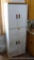 White storage cabinet is overall sturdy and in good condition. Stands 6' tall x 2' wide x 15