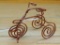 Really cool bent copper wire tricycle is about 3-1/2