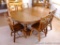Nice dining table by Walter of Wabash, Wabash, Indiana has two leaves and six chairs. Table with