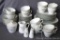 White rose pattern china is unmarked, includes eight dinner plates and salad plates, seven bowls,