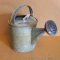 Grandma's galvanized watering can with original metal diffuser head, stands over a foot tall. Solid