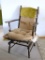 Wooden stationary spring rocker is sturdy and in good shape. Minor wear on arms show that this chair