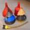 Assortment of plastic and metal funnels. Largest is 9