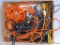 Assortment of extension cords including from 25' to 50'. Includes 2 trouble lights.