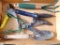 Gardening hand tools including spade, rake, grass clippers, and pruners.