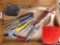 Gardening hand tools including spade, rake, grass clippers, brush, dandelion picker and pruners.