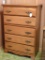 Five drawer dresser is sturdy and in good condition. Measures 32