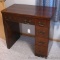 Wooden sewing machine cabinet makes a great desk. Machine is not included. Cabinet/desk measures 33