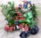 Quantity of faux flowers, ferns, evergreen, etc. Also wrought iron candle holder, more.