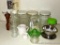 Glass canisters, heavy glass milk pitcher, creamer, pepper grinder, green Depression glass reamer,