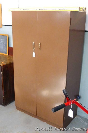 Metal storage cabinet is 36" x 19" x 63" tall has magnetic close doors, upper shelf and appears in