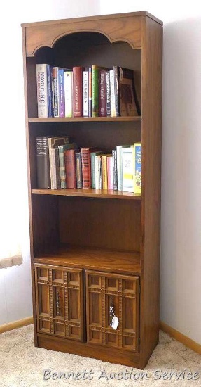 Nice sturdy bookcase with enclosed storage on bottom. Stands approx. 72" high x 26" wide x 13" deep.