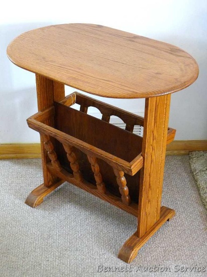 Solid wood side table with magazine/book storage underneath. Table is sturdy and in good shape.