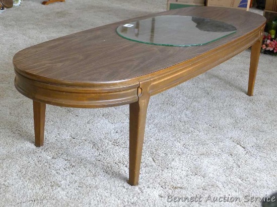 Nice sturdy coffee table is in great condition and measures approx. 5' x 20" x 15" high. Table