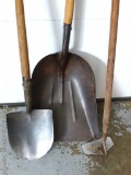 Dirt spade, mason's hoe, steel grain shovel with a three inch crack in the head.