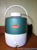 Vintage insulated Coleman drink cooler with built-in cup is the nicest we've seen. I'm guessing it's