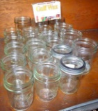 Fifteen half-pint branded jars, plus six pint canning jars and a box of canning wax