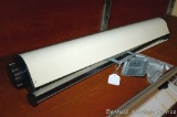 Retractable 5 strand clothesline is approx. 3' wide - good for the basement or yard.