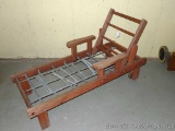 Wooden deck chair - just add cushion. Approx. 5' long. We see a loose screw, may need a little work