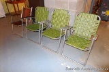 Set of three, plus one other vintage aluminum framed folding lawn chairs are sturdy and in good