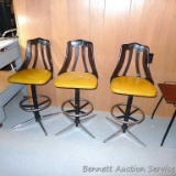 Three retro stools are sturdy and in overall good condition. Each back has a repair in the same spot