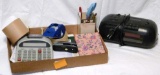 Office supplies including Casio adding machine, packing tape, stapler, notepads, radio alarm clock,