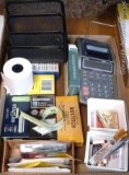 Office supplies including Creamettes promotional tape, Casio adding machine, assorted staples,