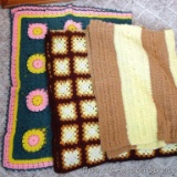 Three handmade afghans are all in good condition. Largest is the darker brown and cream colored