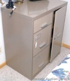 File cabinet with three drawers on left and cabinet door on right. Safe with combination in top