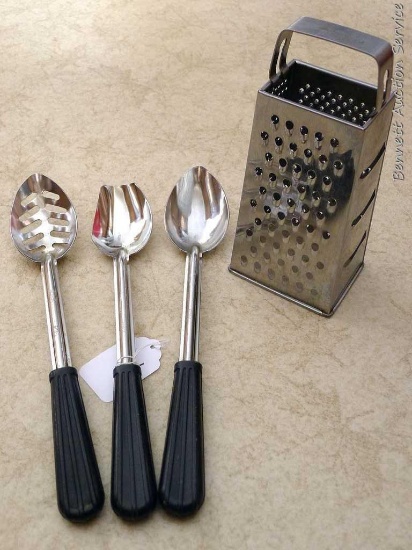 Three 13-1/2" Vollrath stainless steel serving spoons; stainless steel box grater.
