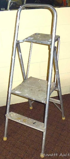 Metal step stool with paint tray, approx. 4 ft. overall. Has some paint splatters.