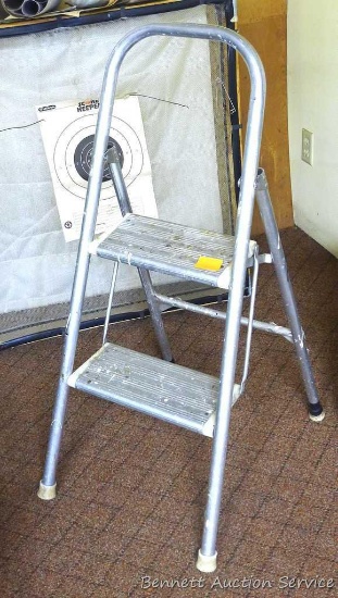 Metal step stool, approx. 40" high. Has some paint splatters.