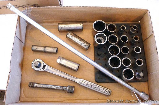 Craftsman 1/2" ratchet with an assortment of deep well and 12 point sockets. Largest is 1-1/4".