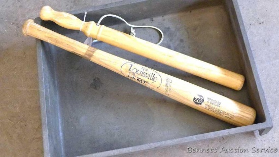 Two wooden tire knockers, approx. 22" long. Plastic tray is 14" x 19" x 2". One club is stamped