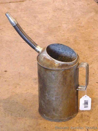 Galvanized four quart oil can with flexible pour spout. Stands approx. 11" high without spout.