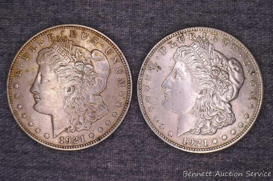 Two Morgan silver dollars including 1921-D and 1921.